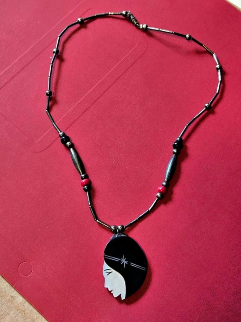 Vtg. art deco woman cameo: mother of pearl, etc... strung necklace.